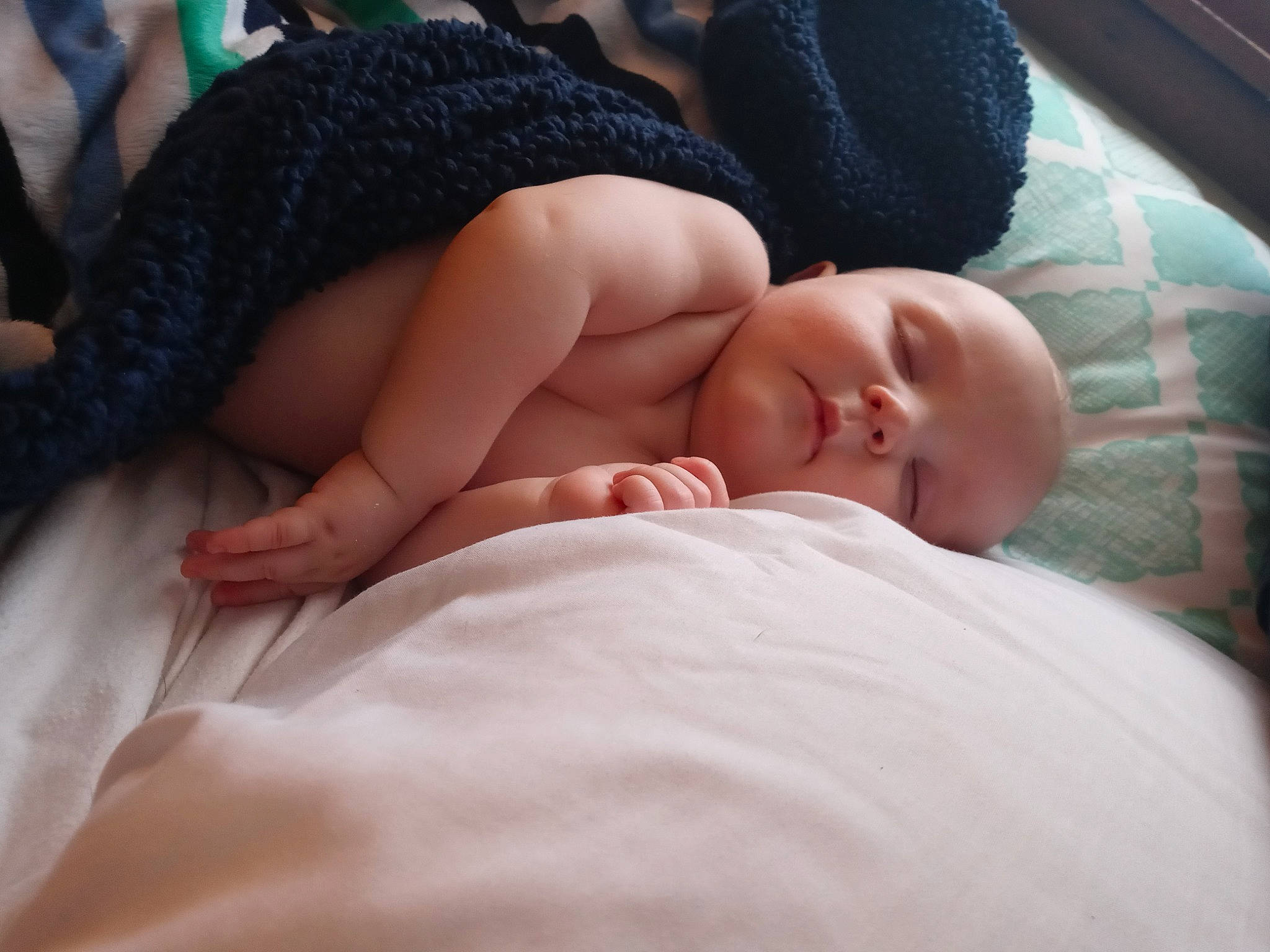 Kooper is registered to the contest to win money with this photo: baby, baby_sleeping, bedding, bedtime, child, comfort, eyelash, flesh, foot, fur, human_leg, linens, nail, nap, person, room, skin, sleep, thumb, toddler