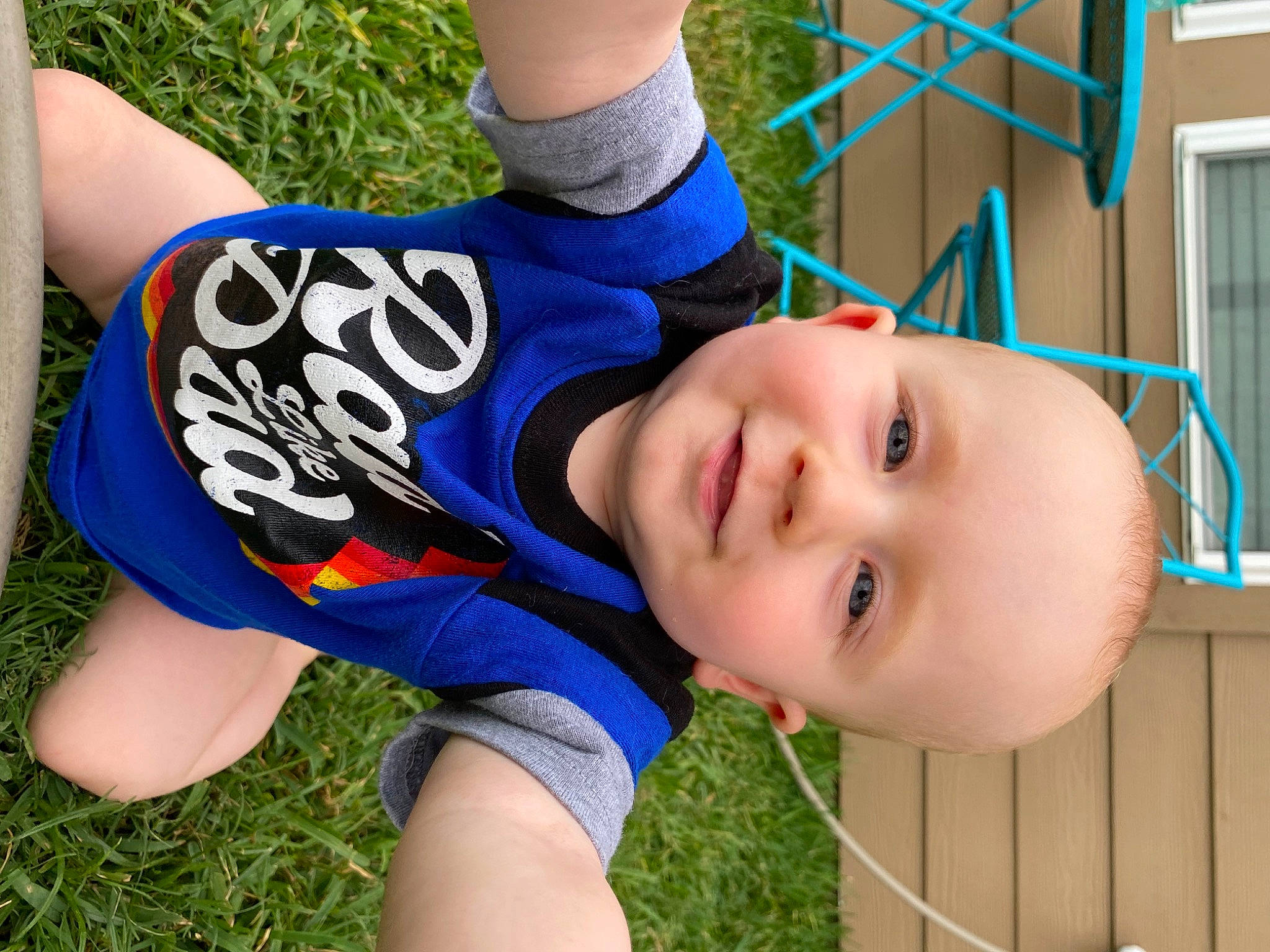 Gatlin is registered to the contest to win money with this photo: blue, child, cool, elbow, electric_blue, finger, fun, grass, happy, hat, human_body, joy, lawn, leisure, people_in_nature, person, plant, player, smile, thigh