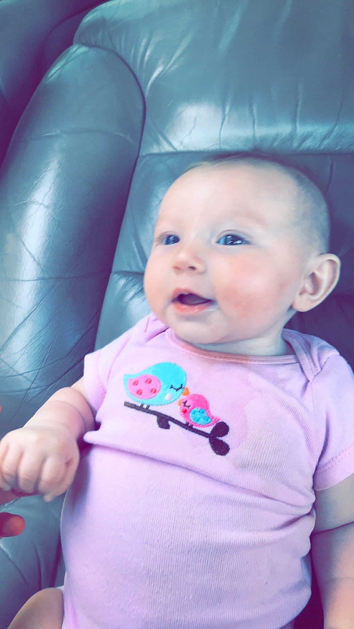 Chaya Faith is registered to the contest to win money with this photo: azure, baby, baby_toddler_clothing, cheek, chin, comfort, cool, eye, facial_expression, finger, happy, iris, nose, person, pink, product, purple, skin, sleeve, smile