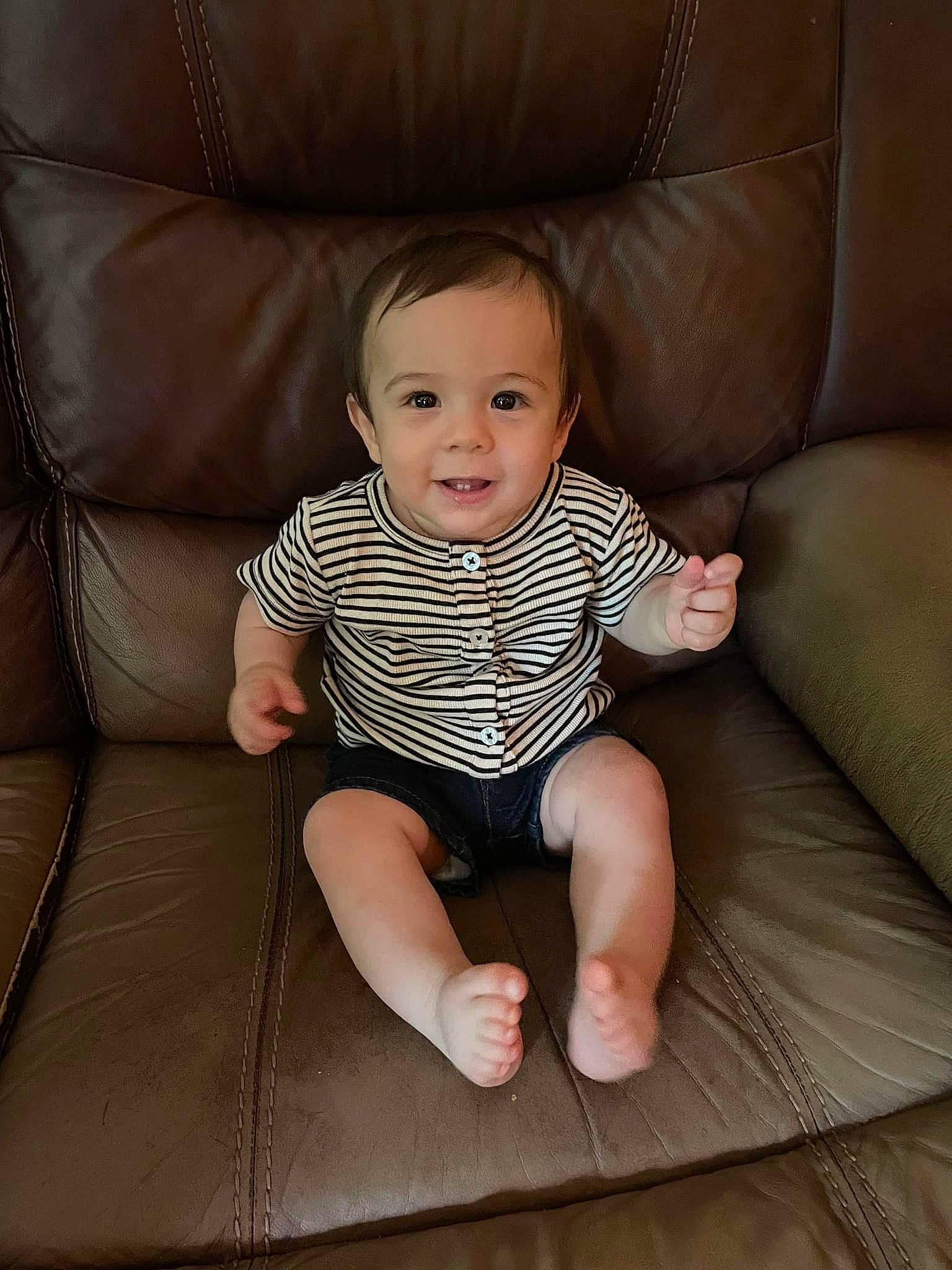 Atticus is registered to the contest to win money with this photo: baby, baby_toddler_clothing, cheek, comfort, couch, finger, flash_photography, flooring, foot, hand, human_body, human_leg, iris, joy, leg, neck, person, skin, sleeve, smile