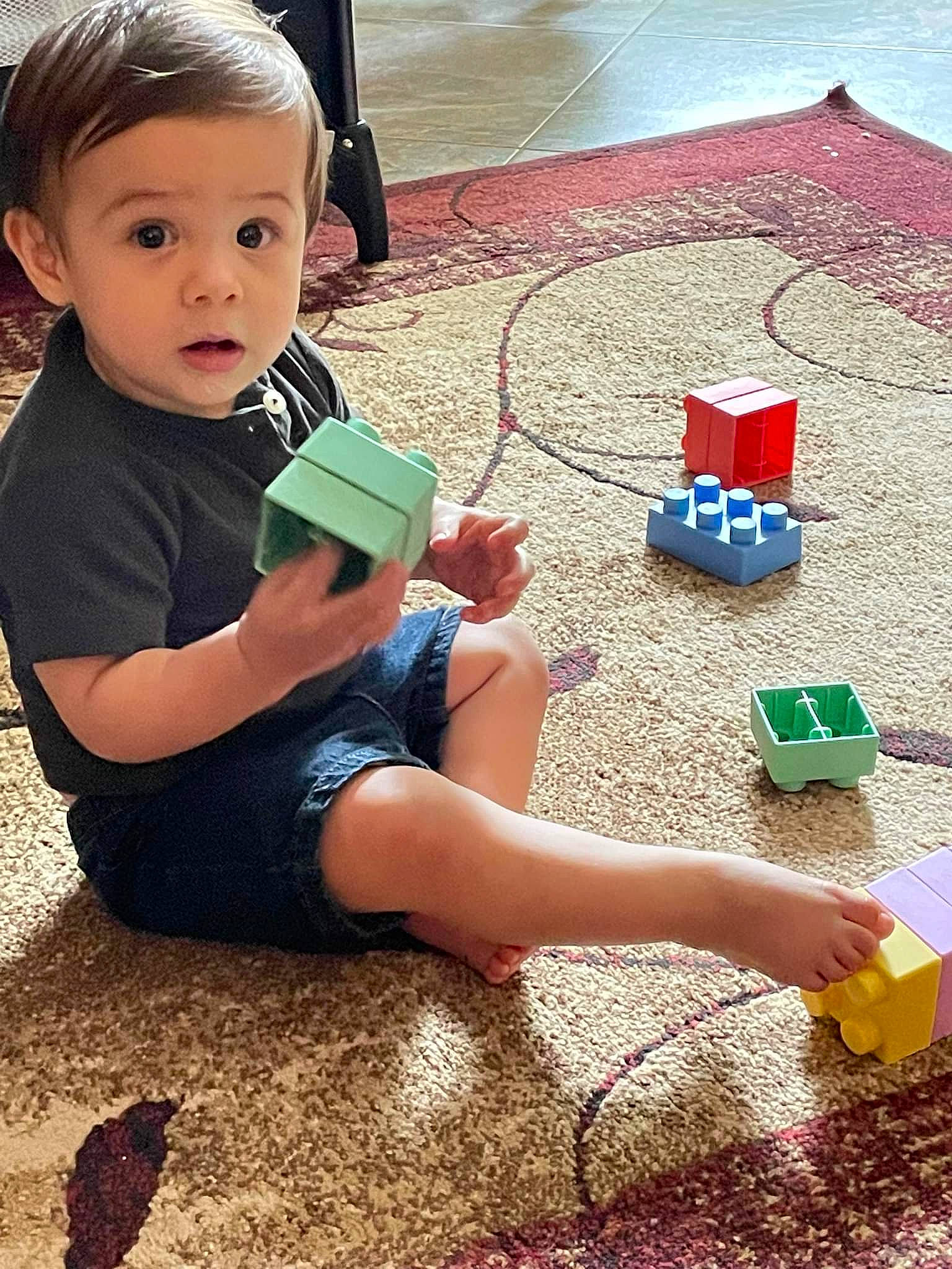 Atticus joined the competition — help win amazing prizes! baby_playing_with_toys, baby_toddler_clothing, child, finger, flooring, fun, happy, human_leg, leisure, people, person, play, shoe, sitting, standing, summer, thigh, toddler, toy, toy_block