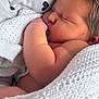 newborn, baby, sleeping, blanket, knitted, pillow, heart_pattern, closeup, face, skin, arm, cozy, soft, rest, infant, cute, peaceful, indoors, warm, comfort