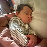Otto-Ray is registered to the contest to win money with this photo: baby, sleeping, blanket, onesie, infant, cozy, bed, pillow, peaceful, child, rest, cute, indoor, soft, young, portrait, hands, peace, comfort, face