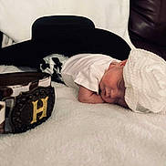 Amiracle joined the competition — help win amazing prizes! baby, belt, bonnet, closeup, clothing, cozy, cute, fabric, golden_buckle, headwear, indoor, infant, newborn, peaceful, person, portrait, rest, sleeping, soft_texture, white_blanket