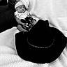 Amiracle joined the competition — help win amazing prizes! baby, baby_girl, black_and_white, blanket, clothing, couch, cowboy_hat, cozy, cute, fabric, hat, headband, indoor, infant, newborn, peaceful, portrait, resting, sleeping, soft_texture