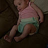 Emma is registered to the contest to win money with this photo: baby, infant, couch, blanket, clothing, pastel_colors, indoor, relaxed, child, person, portrait, soft_furniture, cute, small, sitting, young, head, legs, arms, skin