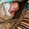 baby, newborn, sleeping, blanket, crochet, cushion, patterned, striped, floral, cozy, indoors, rest, peaceful, wrapped, soft, face, person, child, homedecor, comfort