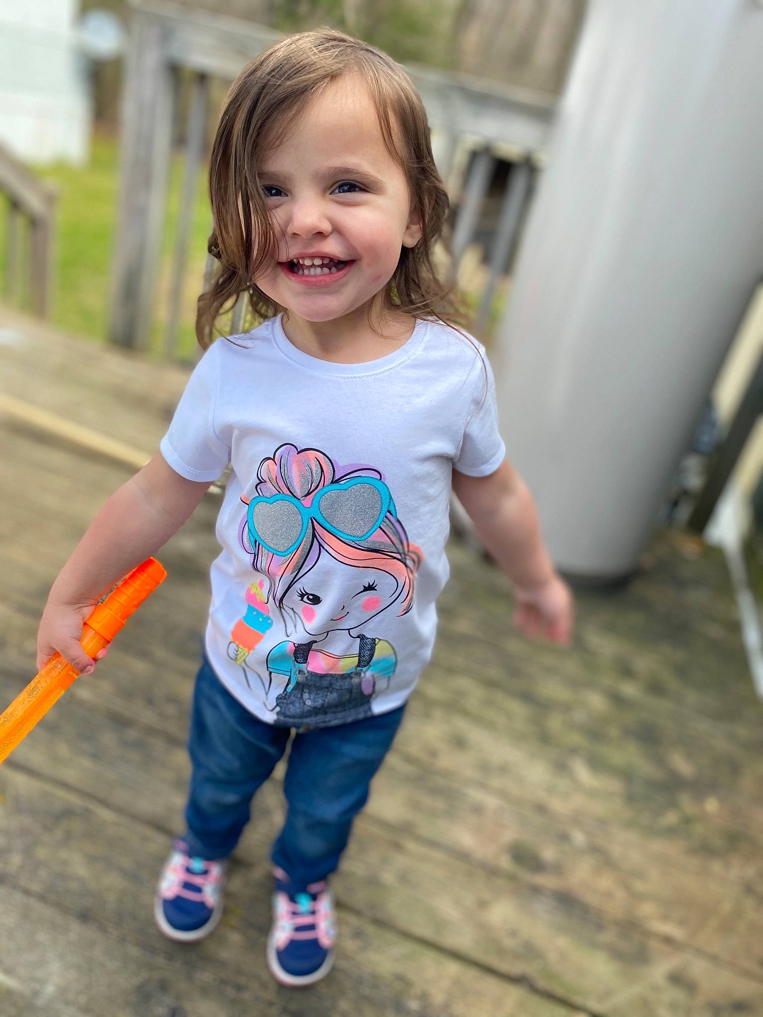 Emilee joined the competition — help win amazing prizes! child, child_model, face, facial_expression, fun, happy, jeans, joy, people, person, photography, plant, play, recreation, skin, sleeve, smile, summer, t_shirt, toddler