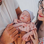 Daniel joined the competition — help win amazing prizes! baby, sleeping, infant, adult, glasses, holding, hands, clothing, patterned_dress, shirt, hat, portrait, family, love, care, closeup, skin, face, gentle, indoor