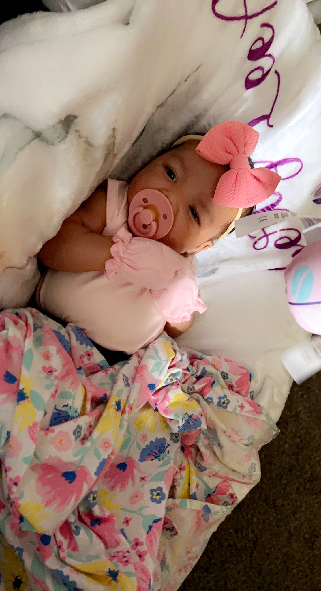 Liberty is registered to the contest to win money with this photo: baby, baby_products, baby_sleeping, baby_toddler_clothing, bedtime, cheek, child, comfort, happy, headwear, linens, nap, pattern, person, petal, pink, portrait_photography, skin, sleep, sleeve
