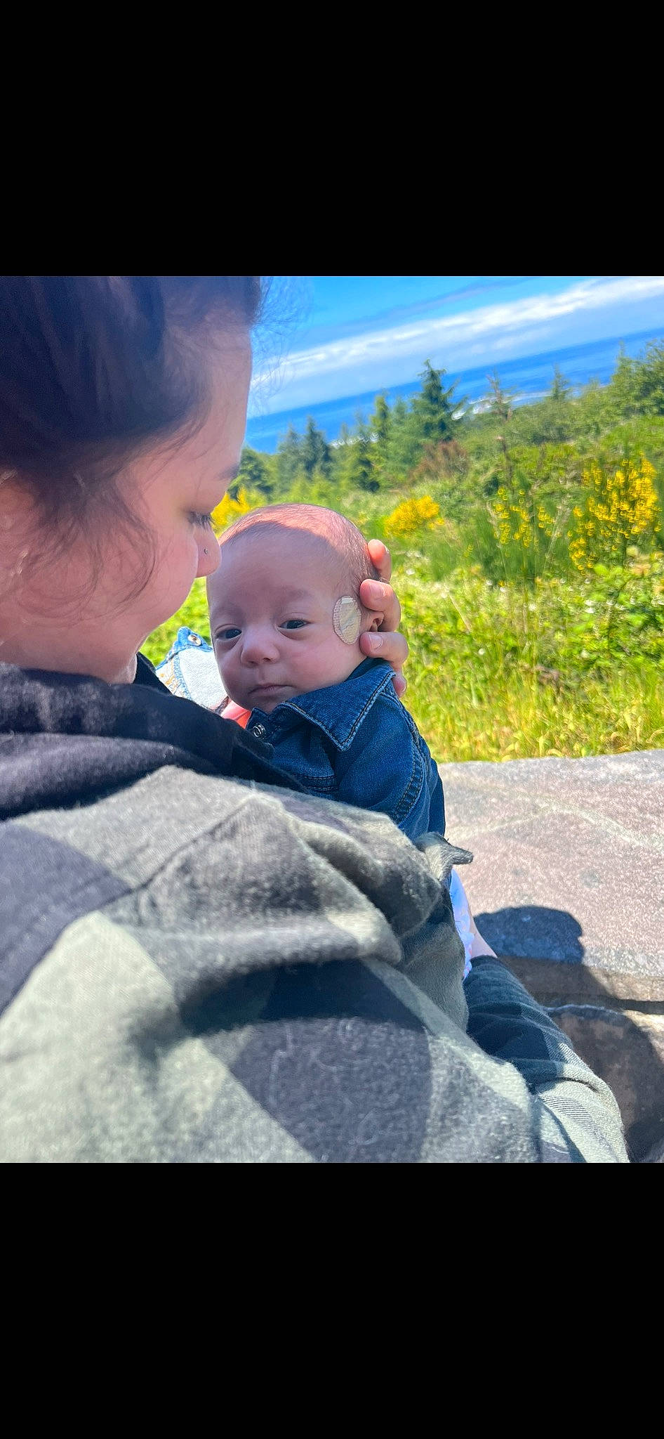 Liliana is registered to the contest to win money with this photo: baby, child, cloud, electric_blue, fun, grass, happy, landscape, leisure, people_in_nature, person, plant, rock, sitting, sky, toddler, tree, vacation