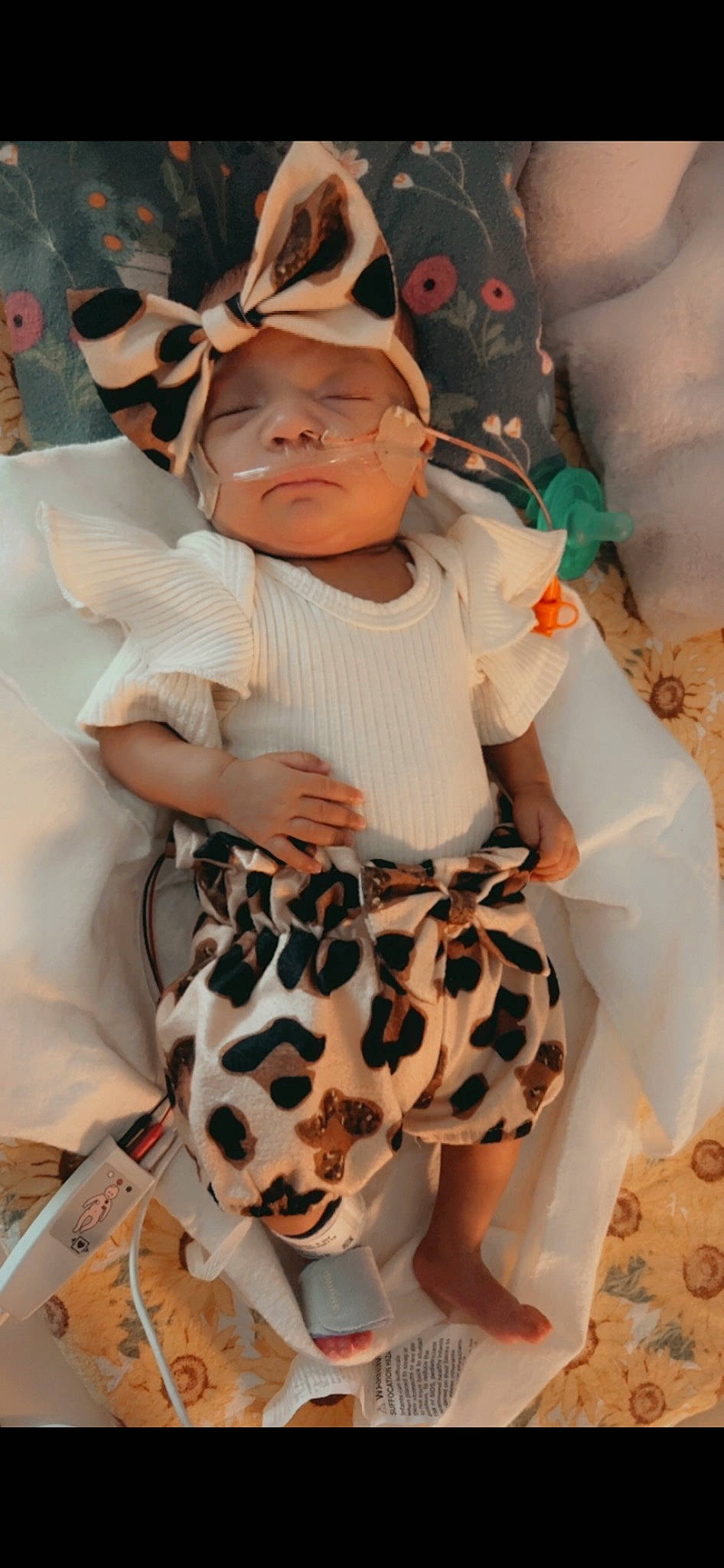 Liliana is registered to the contest to win money with this photo: baby, baby_toddler_clothing, child, comfort, fashion_design, fawn, foot, fur, happy, headwear, human_leg, knee, pattern, peach, person, pink, sitting, skin, sleeve, thigh