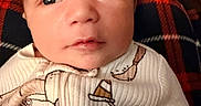 Jeremy joined the competition — help win amazing prizes! baby, infant, face, closeup, onesie, clothing, plaid, pattern, child, newborn, portrait, cute, skin, eyes, mouth, head, cozy, soft_light, indoor, person