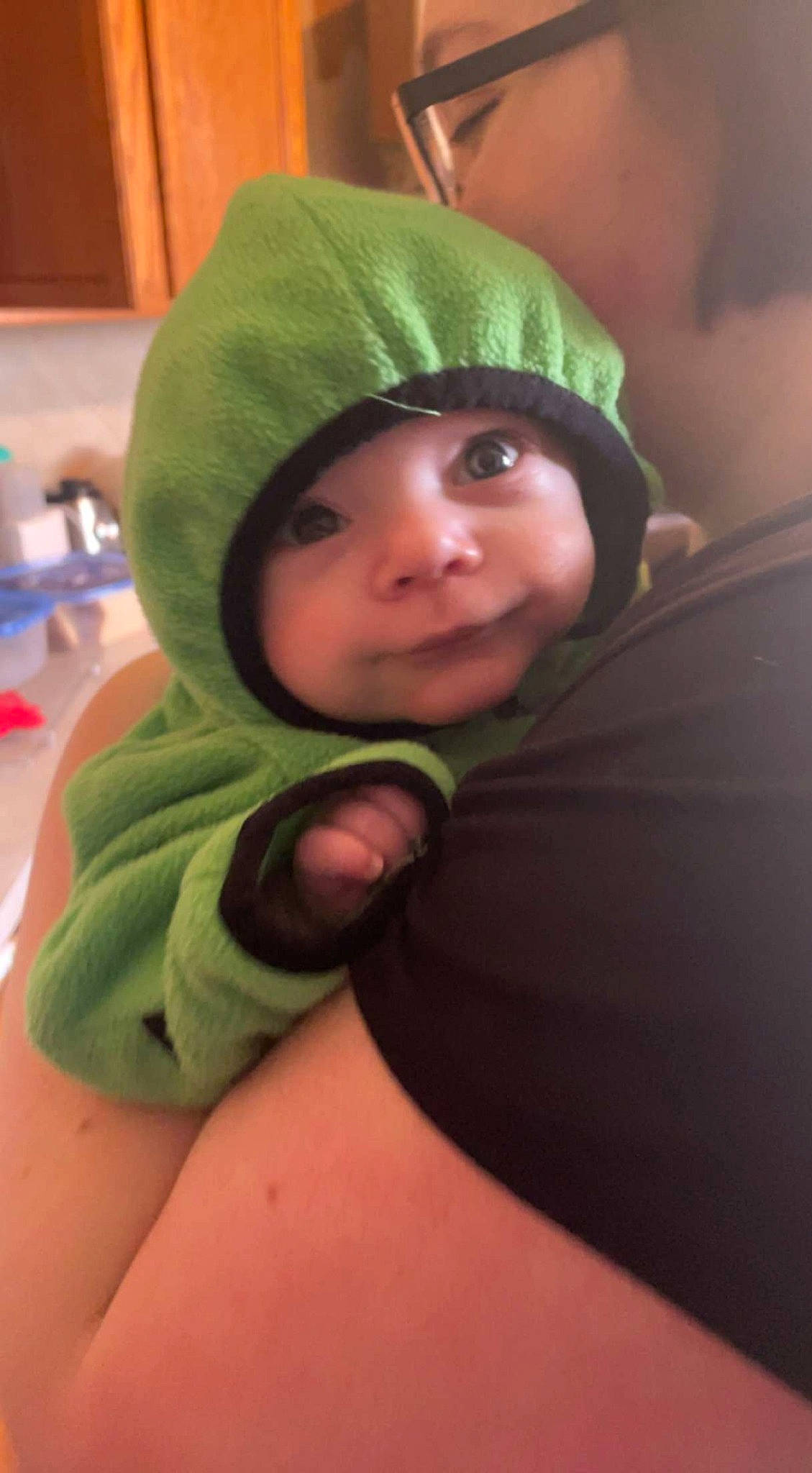 Darrell is registered to the contest to win money with this photo: baby, beanie, bonnet, cap, cheek, child, comfort, eye, fun, grass, happy, headgear, headwear, hoodie, knit_cap, person, personal_protective_equipment, room, sitting, toddler