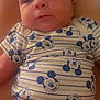 Zyaire joined the competition — help win amazing prizes! baby, infant, child, mickey_mouse, clothing, onesie, cute, face, skin, person, legs, torso, head, eyes, mouth, hair, sitting, comfort, soft_lighting, indoors