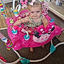 baby, child, girl, pink, bow, face, smiling, baby_jumper, toy, minnie_mouse, floor, carpet, crib, family_photos, room, clothing, happy, indoor, person, playtime