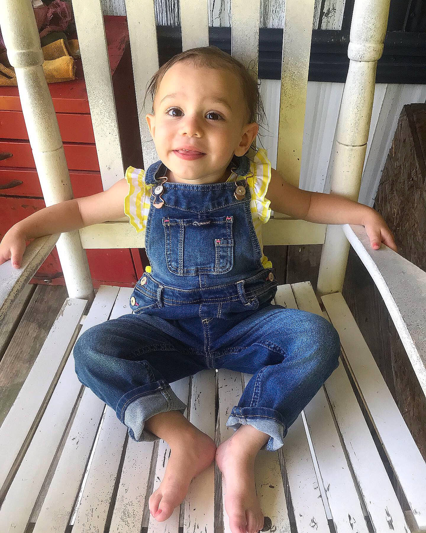 Scarlett joined the competition — help win amazing prizes! child, denim, jeans, leg, person, sitting, smile, toddler, vacation, wood