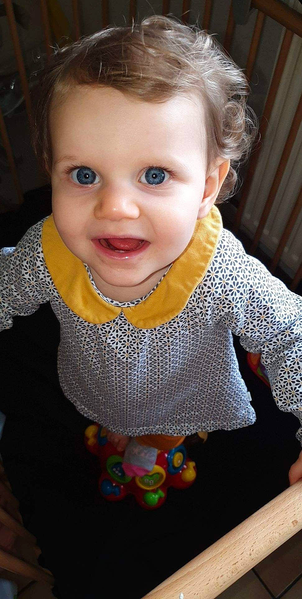 Kimberley participe au concours pour gagner de l'argent avec cette photo : baby, baby_toddler_clothing, blond, cheek, child, dress, eye, face, head, iris, lip, neck, nose, outerwear, person, skin, sleeve, smile, sweater, toddler