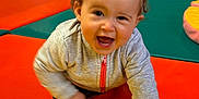 Ezra participe au concours pour gagner de l'argent avec cette photo : active, baby, child, colorful_mats, crawling, cute, fun, gray_jacket, green_mat, happy, indoor, infant, orange_mat, person, pigtails, pink_zipper, play_area, smiling, yellow_mat, young_child