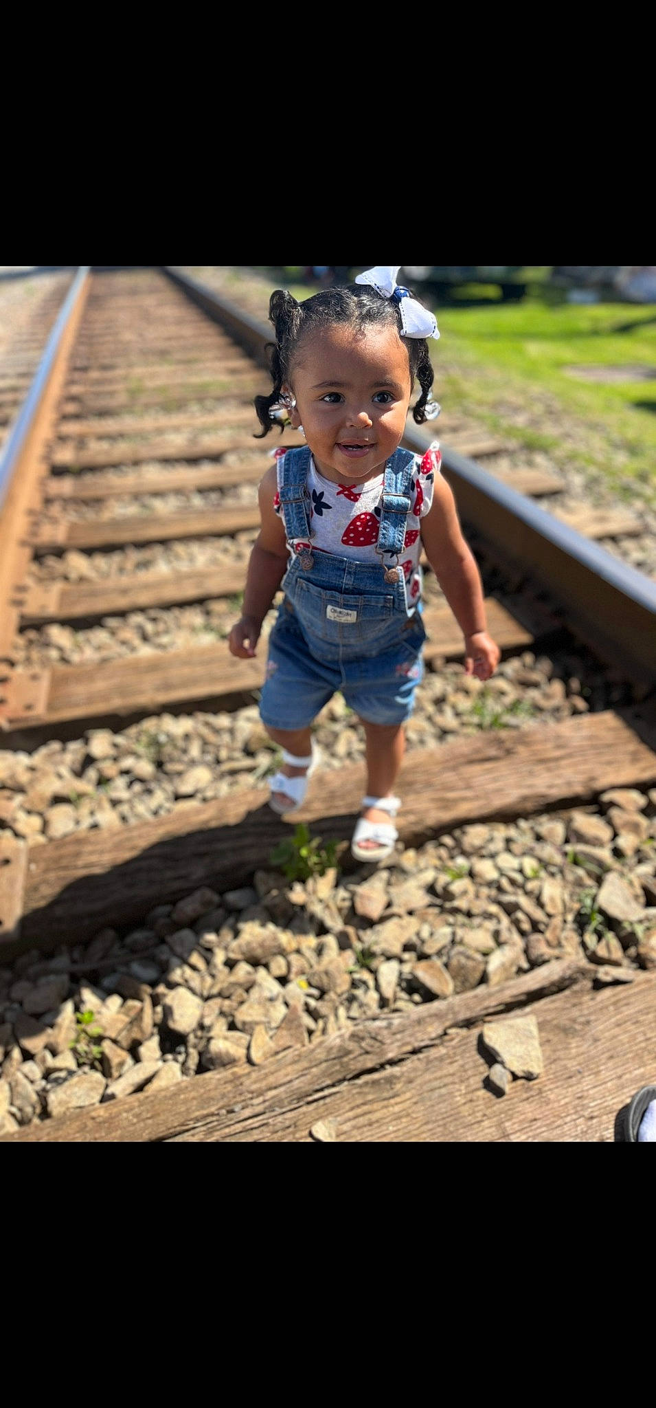 Braelyn is registered to the contest to win money with this photo: baby, baby_toddler_clothing, child, electric_blue, eye, fun, grass, happy, human_leg, joy, leaf, leisure, people_in_nature, person, sitting, smile, soil, spring, toddler, track