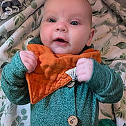 Ryne joined the competition — help win amazing prizes! baby, infant, child, face, hands, onesie, bib, blanket, leaf_pattern, animal_pattern, cozy, curious, indoor, portrait, cute, skin, eyes, button, pacifier, soft