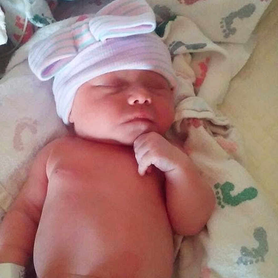 Melynnie joined the competition — help win amazing prizes! baby, blanket, bow, child, cute, diaper, face, footprints, hand, hat, hospital, infant, lying_down, newborn, peaceful, portrait, resting, skin, sleeping, soft