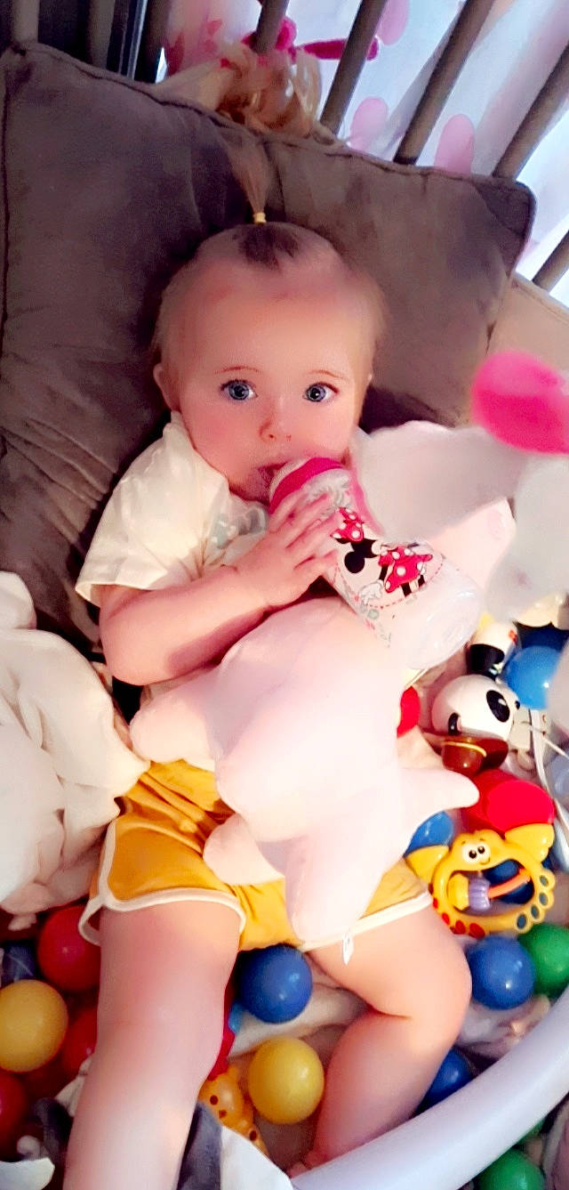 Tessa participe au concours pour gagner de l'argent avec cette photo : baby_toddler_clothing, cheek, child, eye, eyelash, happy, head, mouth, nail, nose, organ, person, pink, product, skin, textile, thigh, thumb, toddler, toy