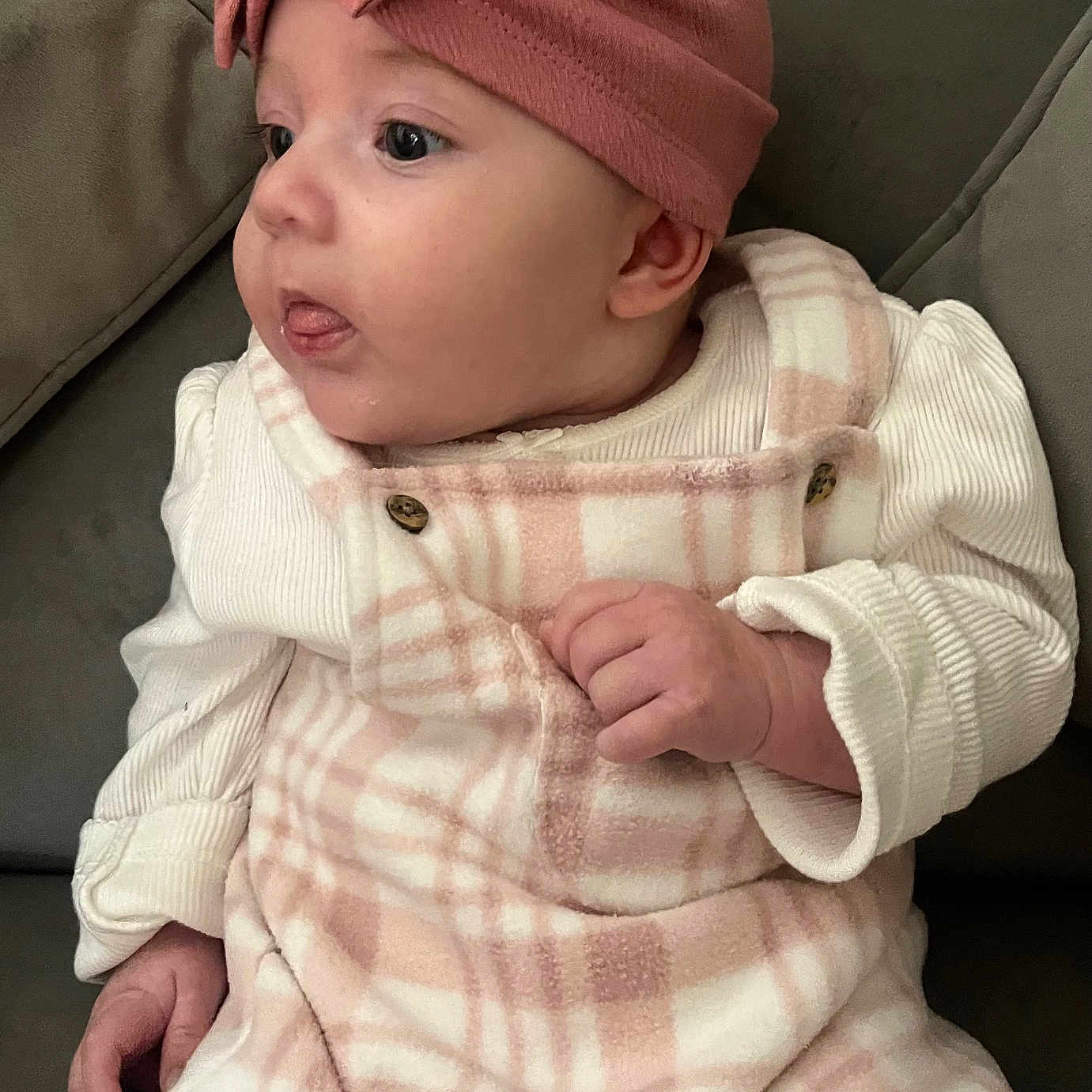 Hope-Dotty joined the competition — help win amazing prizes! baby, child, clothing, couch, cozy, curious, cute, face, furniture, hand, headband, indoor, infant, person, pink, plaid, portrait, soft, tongue, warm