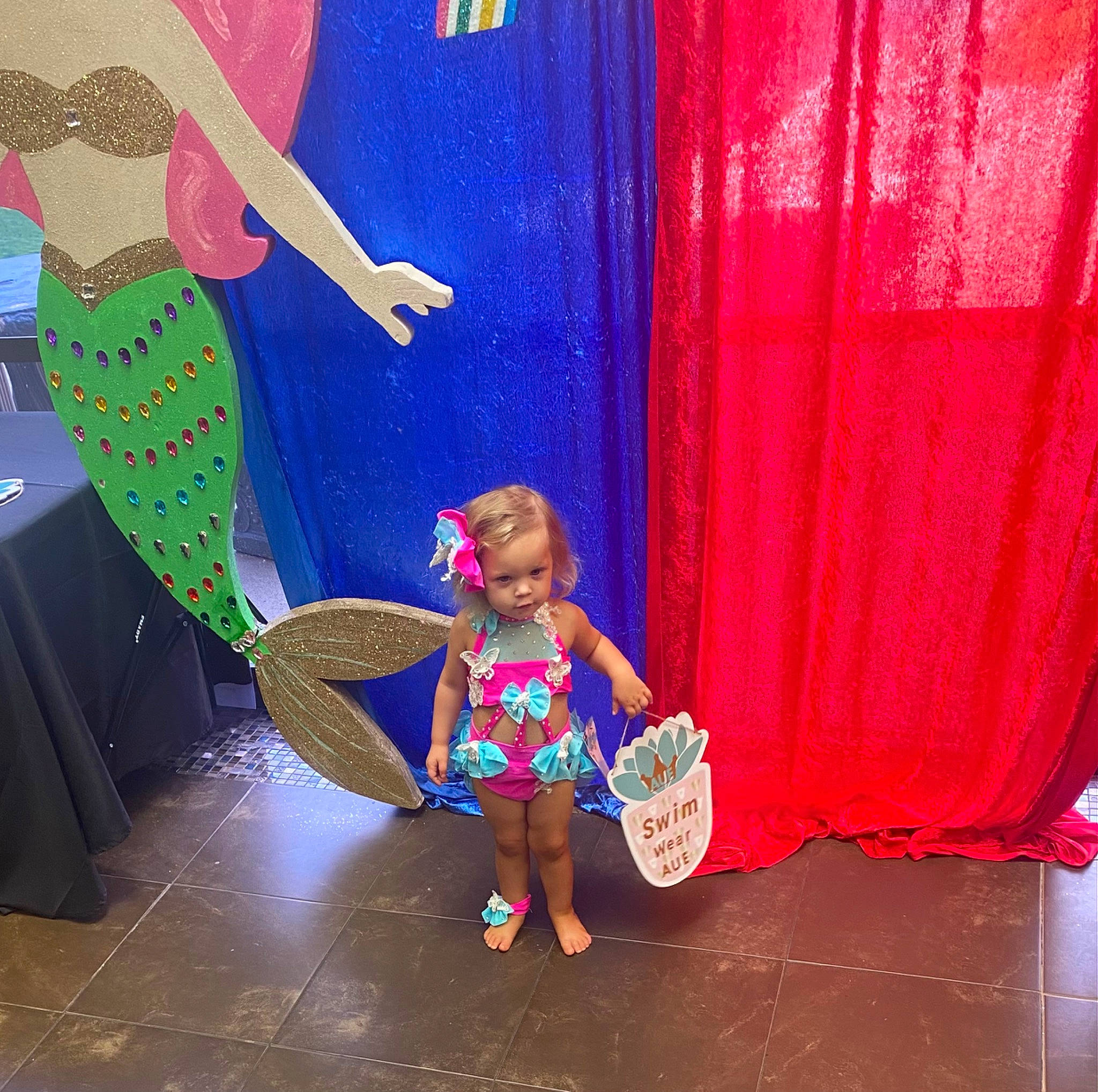 Chevelle is registered to the contest to win money with this photo: art, artist, child, entertainment, event, fashion_design, flooring, fun, happy, human_leg, leisure, magenta, performing_arts, person, pink, play, purple, recreation, sandal, thigh