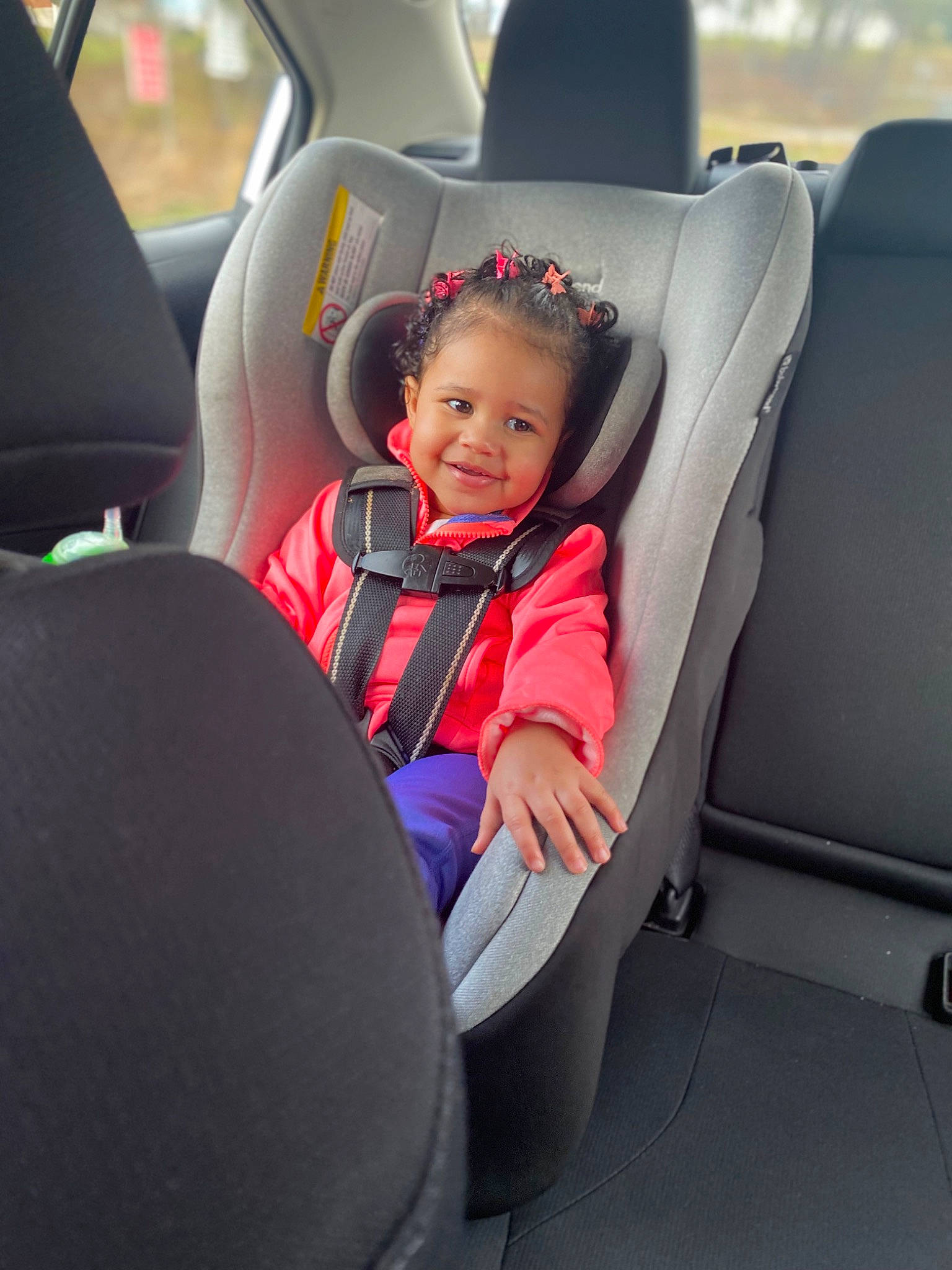 Amora joined the competition — help win amazing prizes! arm, auto_part, automotive_design, automotive_exterior, automotive_tire, automotive_wheel_system, car, car_seat, car_seat_cover, comfort, head_restraint, joy, motor_vehicle, person, personal_luxury_car, smile, steering_part, steering_wheel, toddler, vehicle