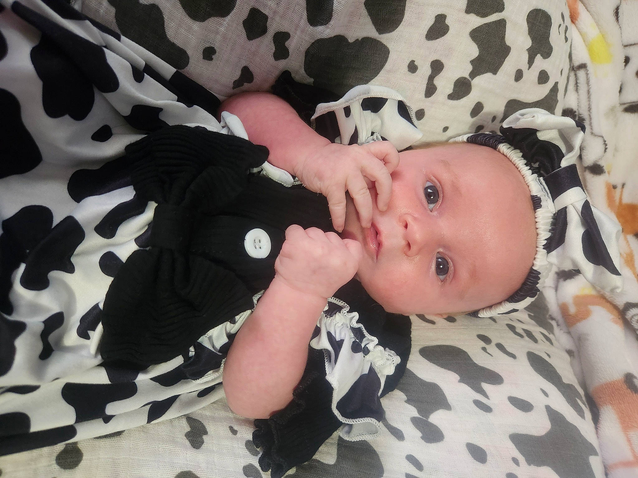 Caroline is registered to the contest to win money with this photo: baby, baby_products, baby_toddler_clothing, cheek, child, comfort, eyelash, iris, linens, pattern, person, sitting, skin, sleeve, toddler, white