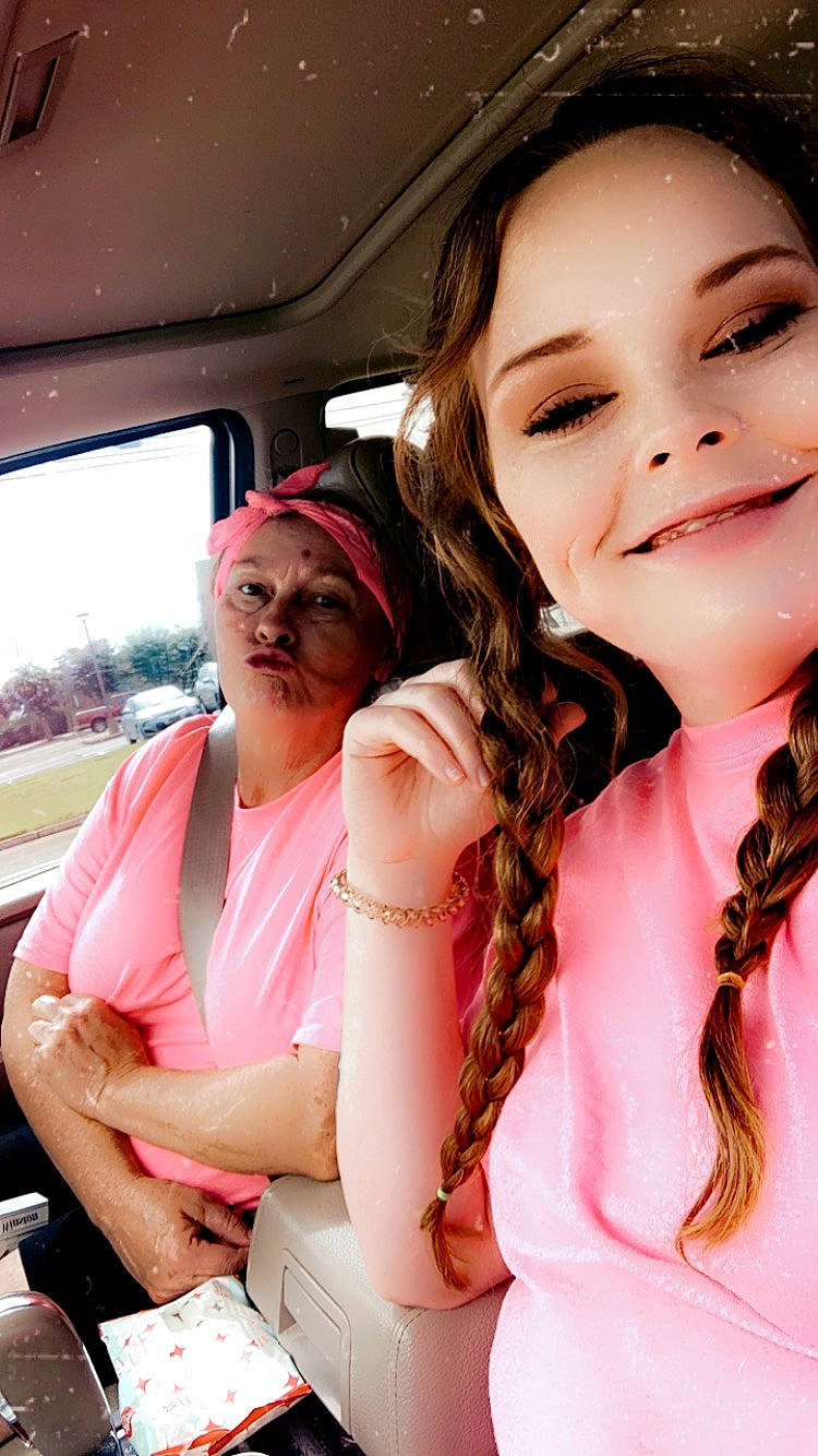 Carson is registered to the contest to win money with this photo: chest, child, event, eyelash, eyewear, family_car, fashion_accessory, finger, fun, gesture, happy, jewellery, joy, lip, motor_vehicle, mouth, necklace, person, pink, skin