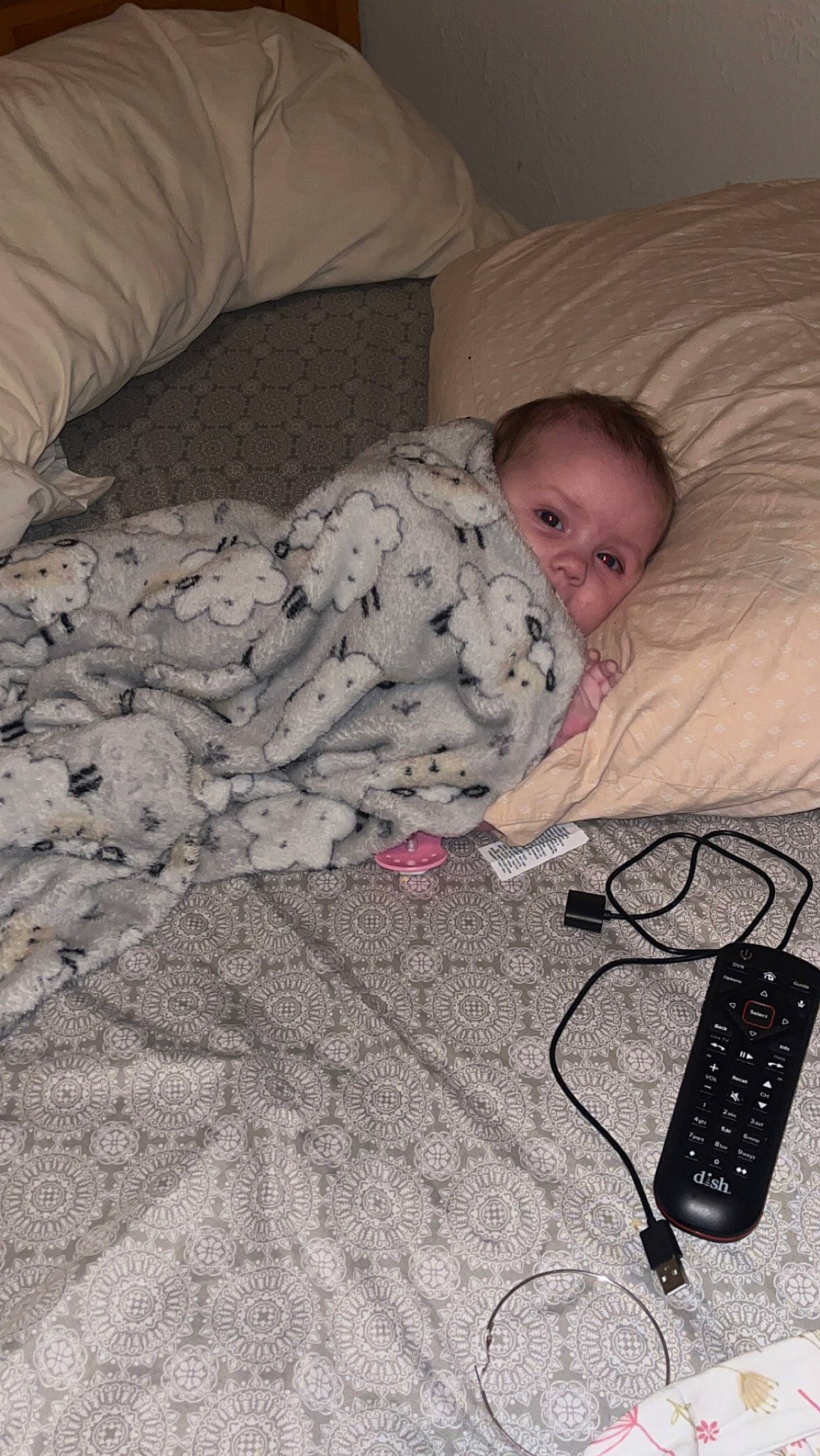 Delilah is registered to the contest to win money with this photo: audio_equipment, baby, bedding, bedtime, cable, child, comfort, communication_device, flooring, hardwood, input_device, linens, mobile_phone, nap, person, room, sitting, telephone, telephony, toddler