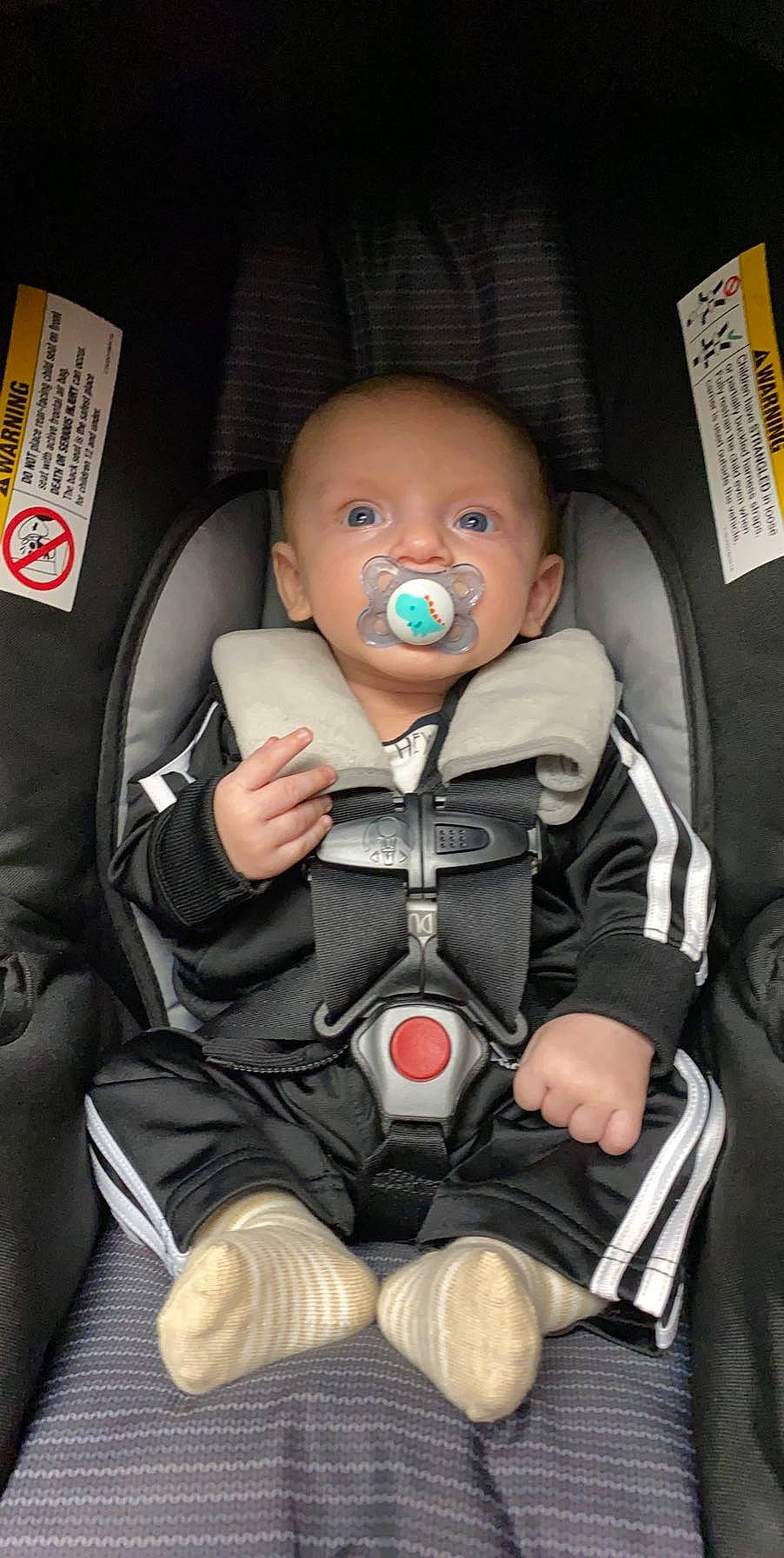 Jericho is registered to the contest to win money with this photo: auto_part, baby, baby_carriage, baby_in_car_seat, baby_products, car_seat, child, person, product, seat_belt, sitting, toddler