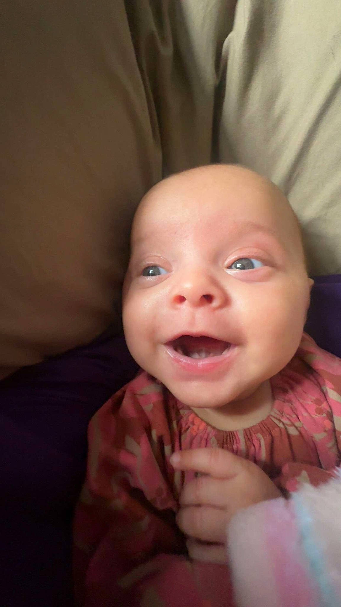 Emery is registered to the contest to win money with this photo: baby, cheek, comfort, ear, eye, eyebrow, face, facial_expression, finger, gesture, happy, head, iris, lip, mouth, nose, person, skin, sleeve, smile