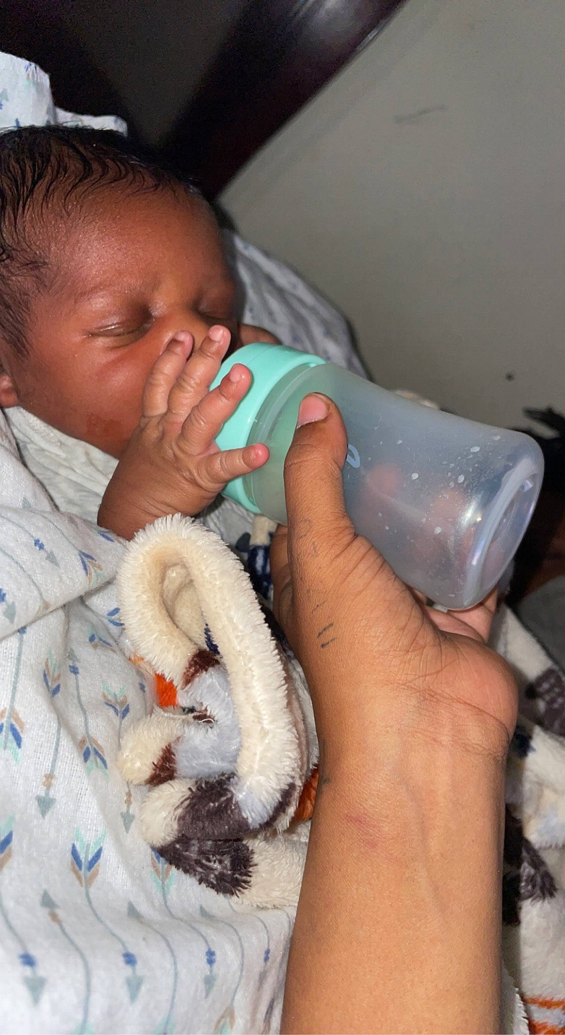 Junior joined the competition — help win amazing prizes! baby, baby_products, baby_toddler_clothing, bedtime, child, childbirth, comfort, finger, flesh, hand, health_care, hospital, linens, mouth, nail, person, room, skin, thumb, toddler