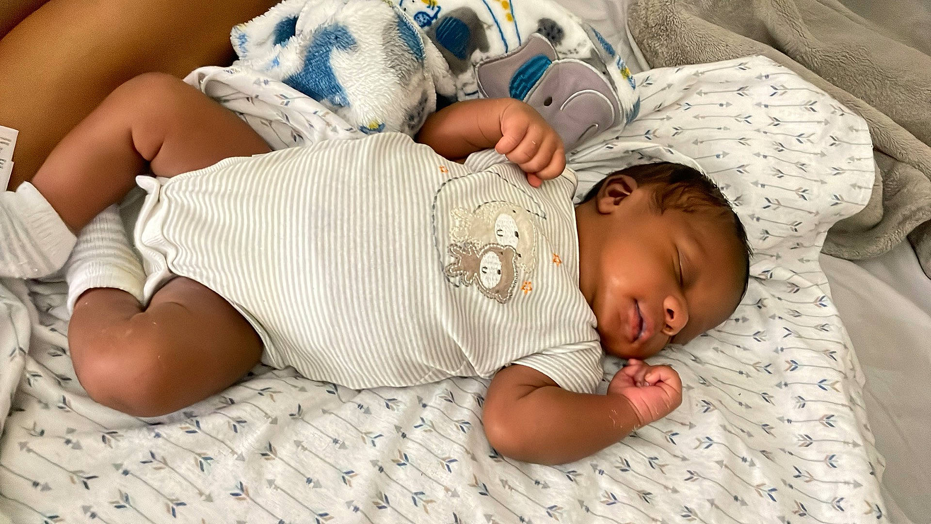 Junior joined the competition — help win amazing prizes! baby, baby_sleeping, baby_toddler_clothing, child, comfort, eye, facial_expression, finger, hand, headgear, human, human_body, leg, linens, mammal, mouth, organ, person, product, skin