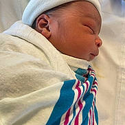 Matthew is registered to the contest to win money with this photo: newborn, baby, sleeping, wrapped, blanket, hospital, hat, side_profile, infant, cute, peaceful, soft, skin, face, closeup, bed, resting, child, young, portrait