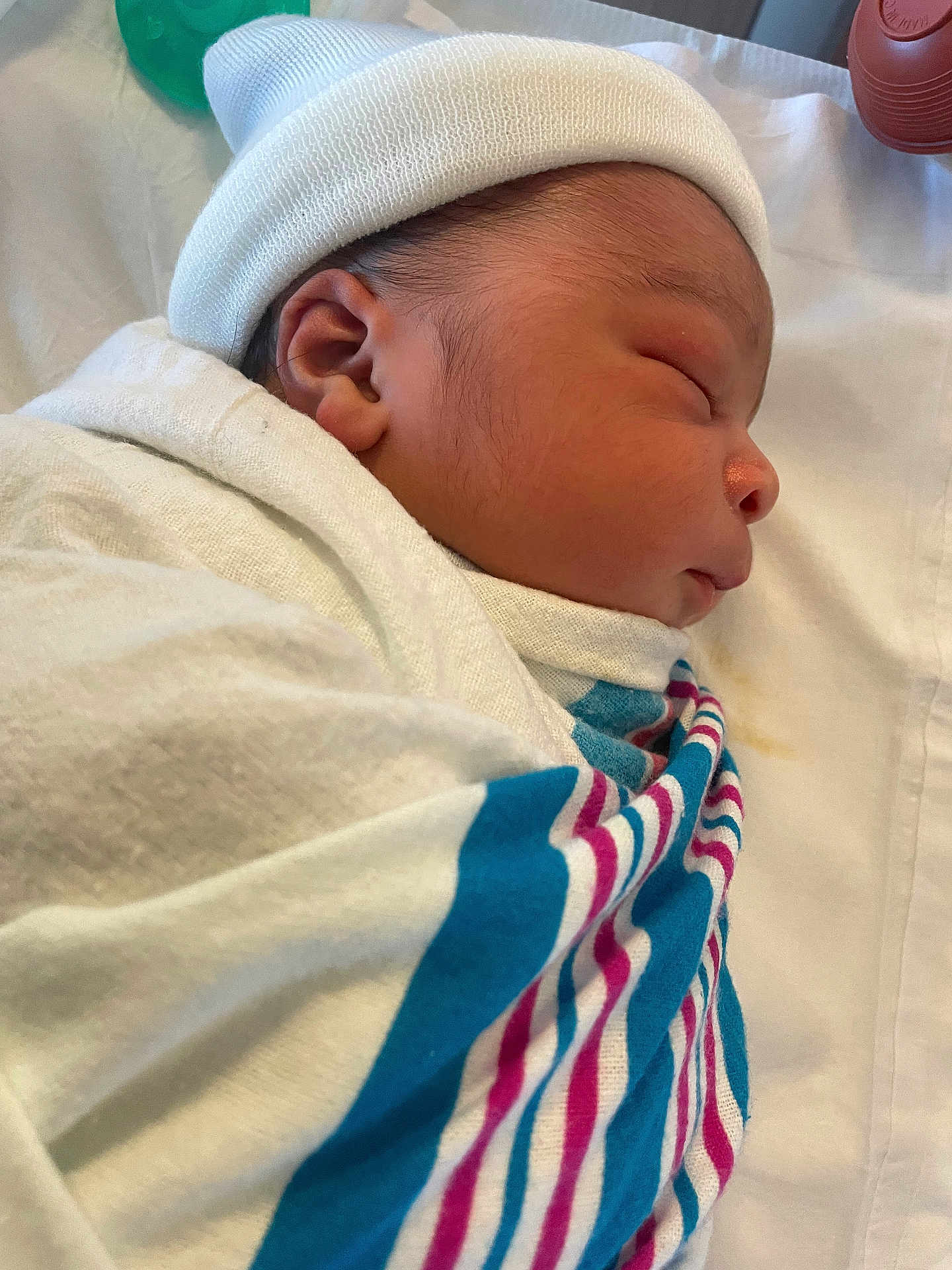 Matthew is registered to the contest to win money with this photo: newborn, baby, sleeping, wrapped, blanket, hospital, hat, side_profile, infant, cute, peaceful, soft, skin, face, closeup, bed, resting, child, young, portrait