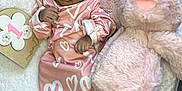 India is registered to the contest to win money with this photo: baby, bed, blanket, bonnet, clothing, couch, dress, face, furniture, hat, head, newborn, person, photography, portrait, quilt, sitting, sleeping, teddybear, toy