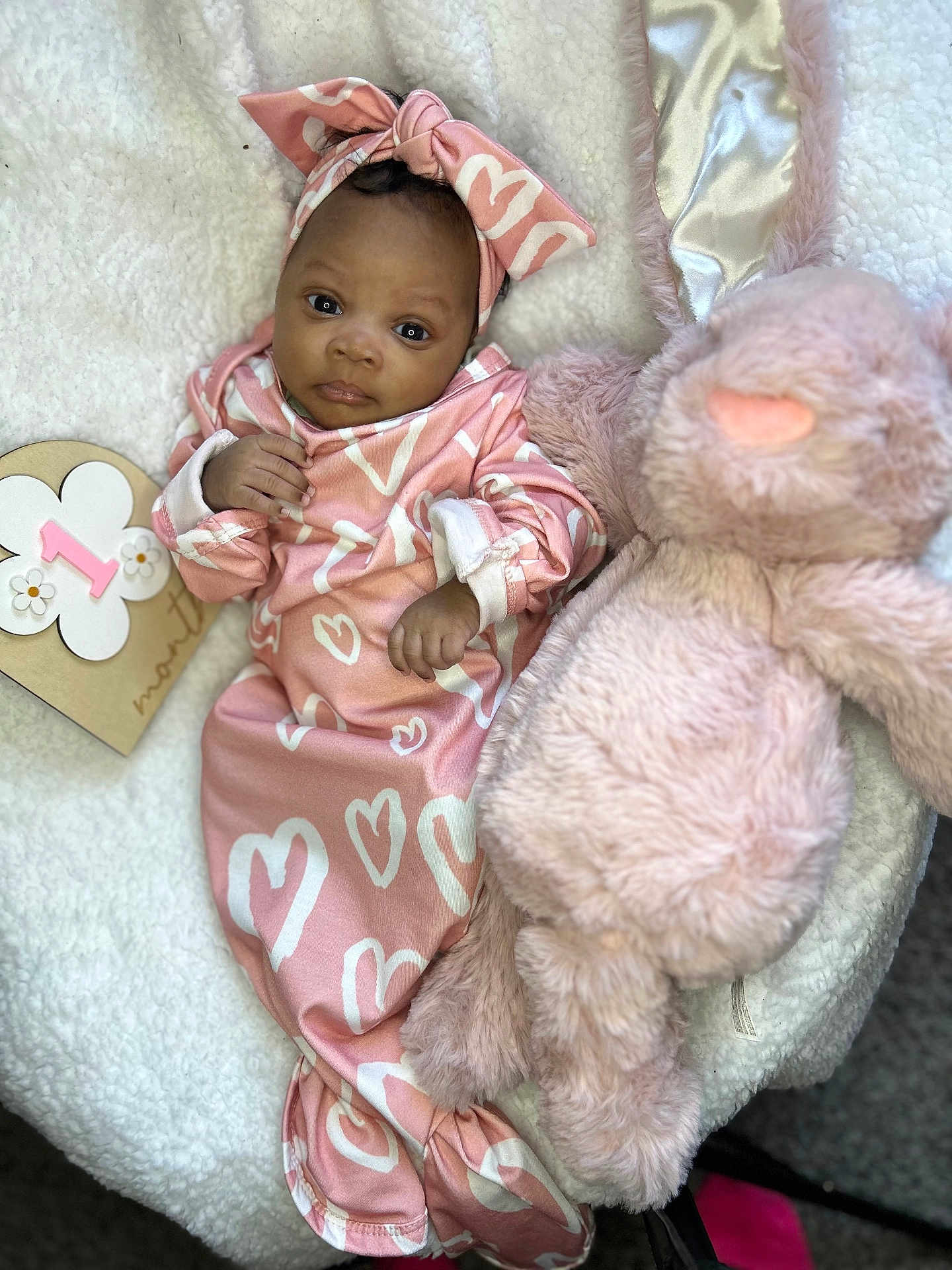 India is registered to the contest to win money with this photo: baby, bed, blanket, bonnet, clothing, couch, dress, face, furniture, hat, head, newborn, person, photography, portrait, quilt, sitting, sleeping, teddybear, toy