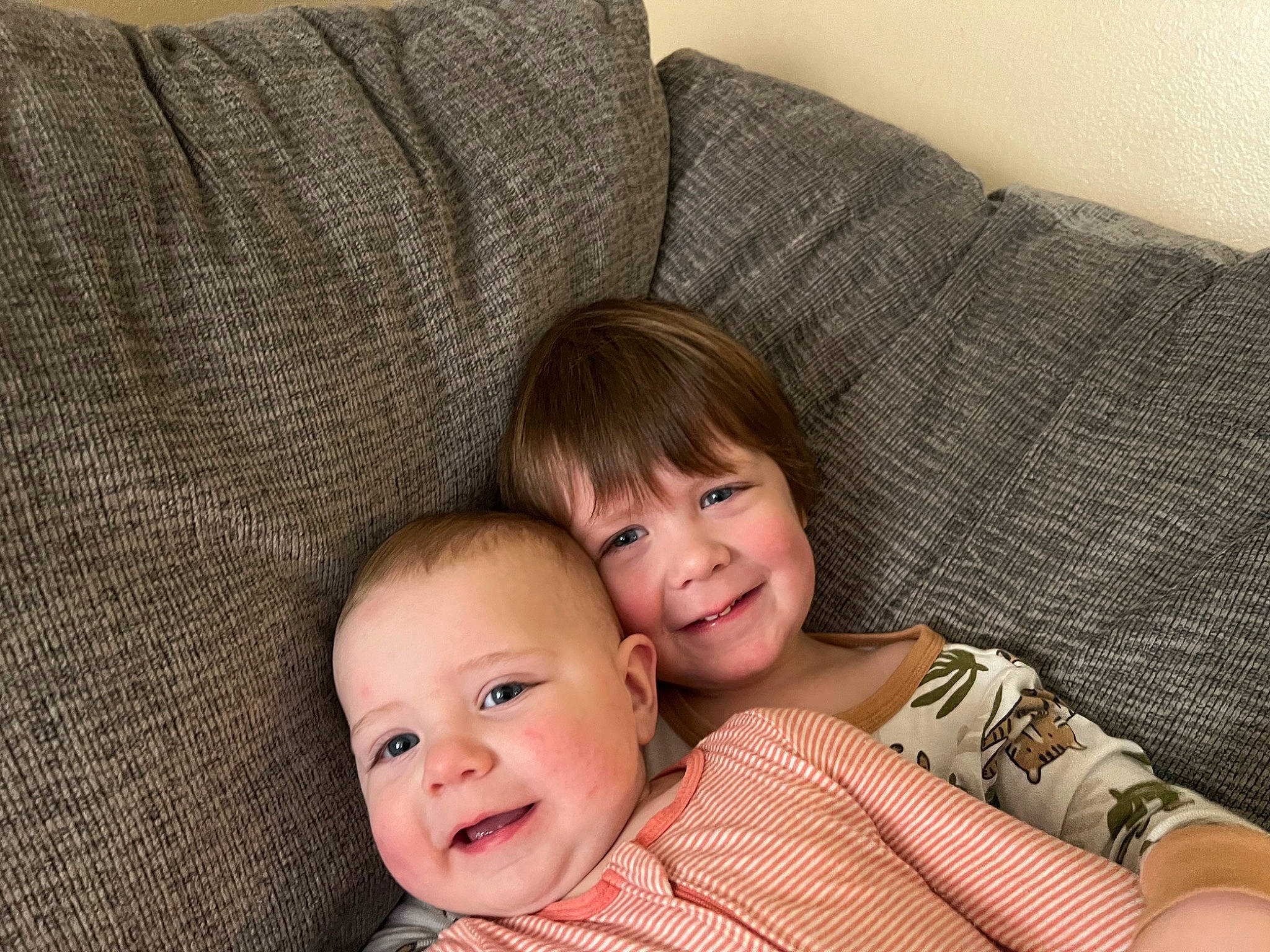 Amelia joined the competition — help win amazing prizes! baby, baby_toddler_clothing, cheek, child, comfort, couch, eye, face, flooring, hair, happy, head, joy, living_room, nose, person, sitting, skin, smile, textile