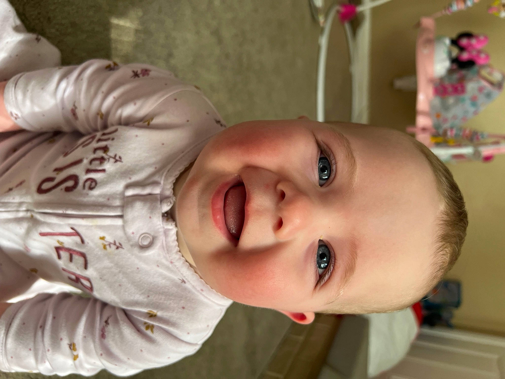 Amelia is registered to the contest to win money with this photo: baby, baby_toddler_clothing, cheek, child, ear, eyelash, forehead, grass, happy, human_body, joy, lip, mouth, nose, person, plant, skin, smile, toddler, tree