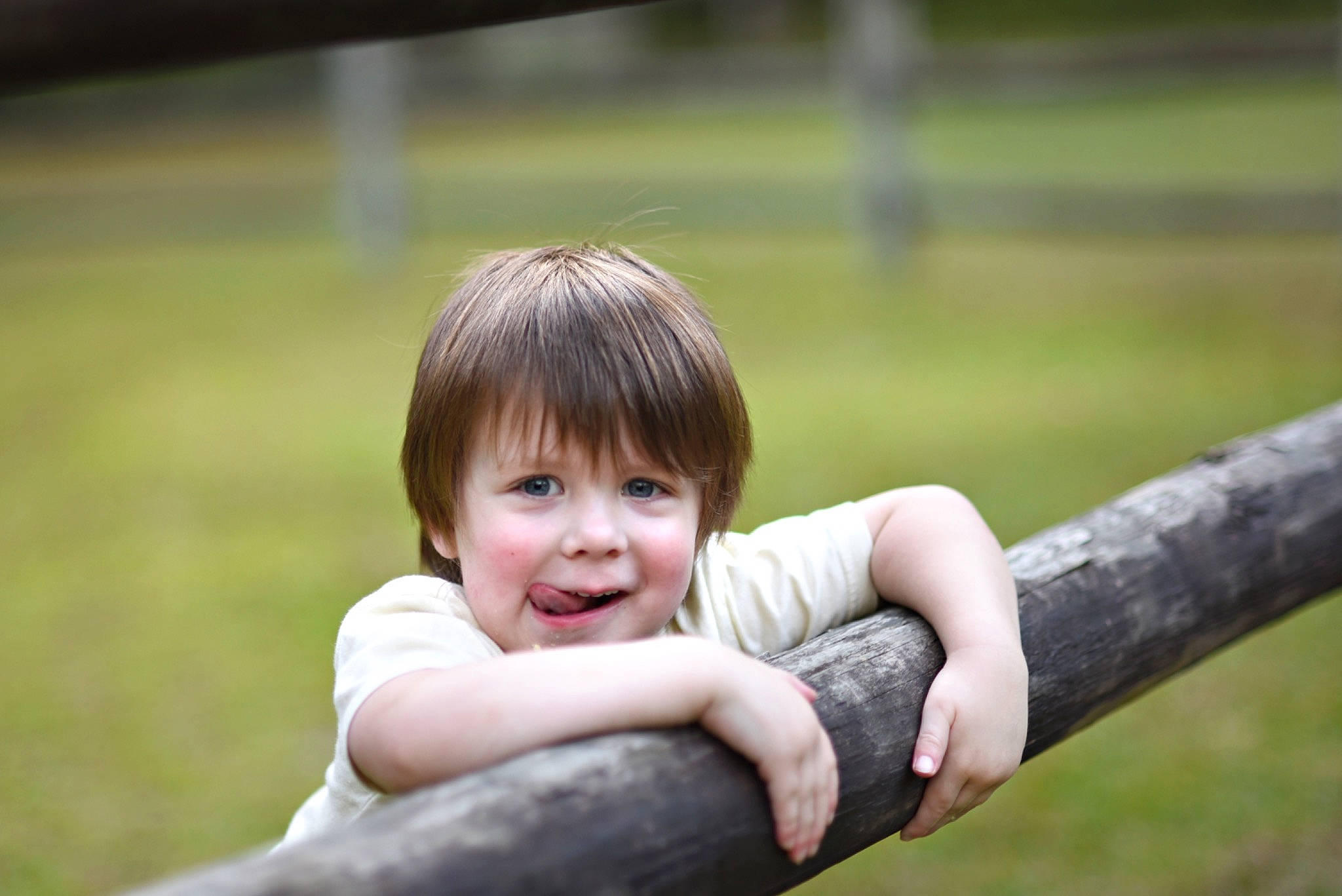 Carson is registered to the contest to win money with this photo: child, elbow, flash_photography, fun, gesture, grass, grassland, hand, happy, joy, leisure, nose, people_in_nature, person, plant, recreation, skin, smile, thumb, toddler