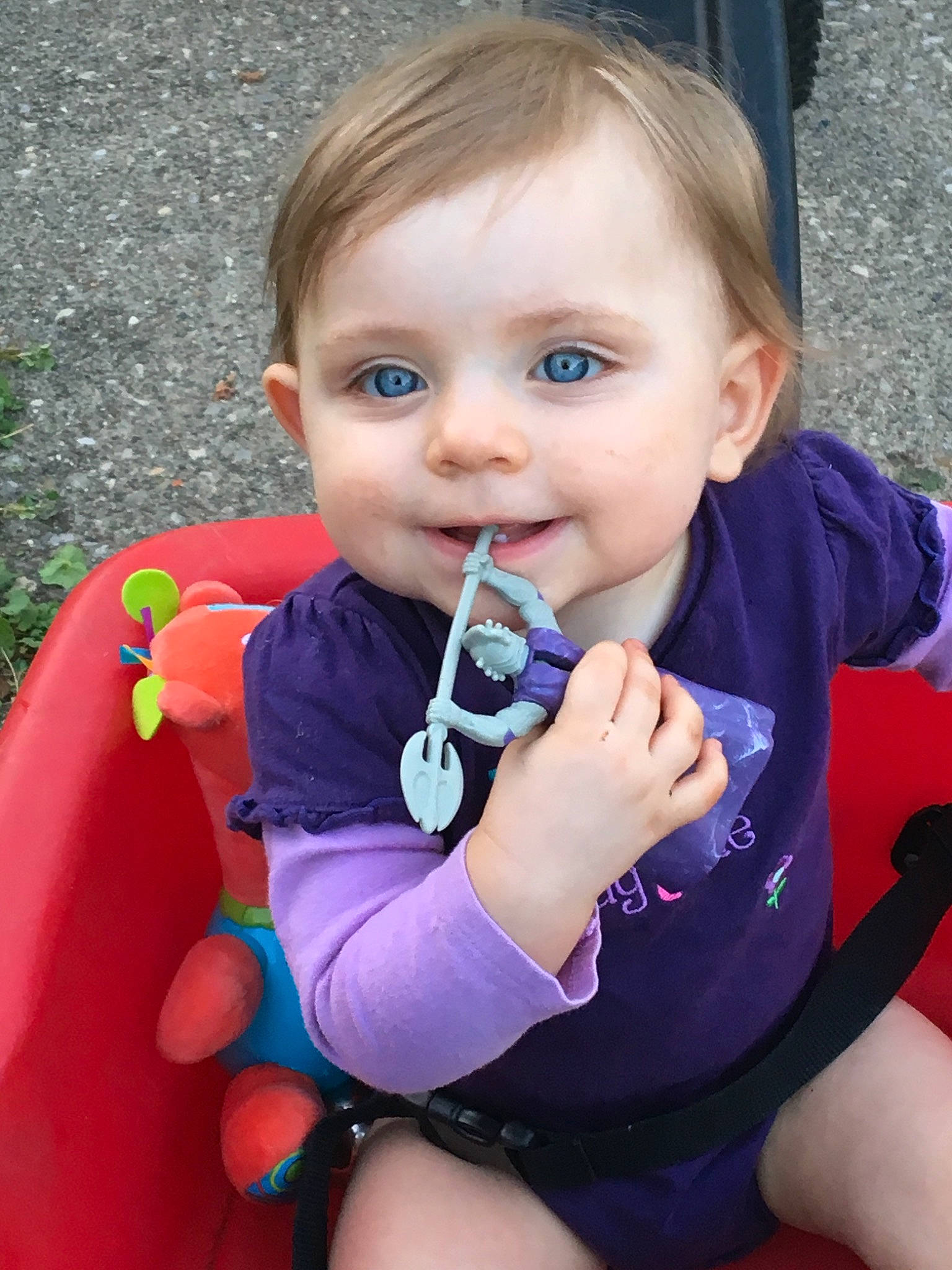 Isabella joined the competition — help win amazing prizes! baby, blond, cheek, child, eye, face, finger, fun, joy, lip, mouth, nose, outdoor_play_equipment, person, play, playground, sitting, skin, smile, swing