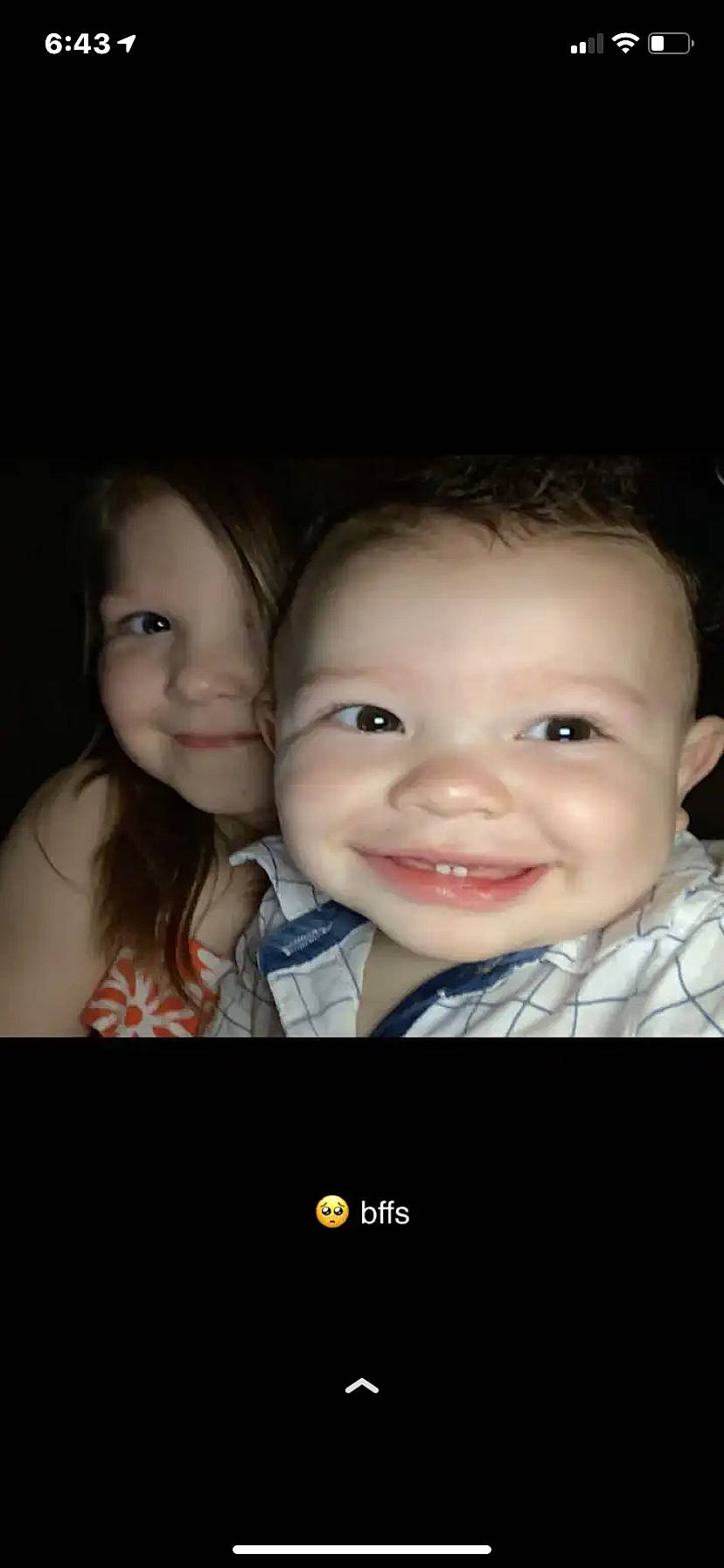 Daquan Jr is registered to the contest to win money with this photo: baby, cheek, child, communication_device, darkness, display_device, eyebrow, flash_photography, fun, gesture, happy, iris, joy, lip, monochrome_photography, nose, outerwear, person, photo_caption, skin