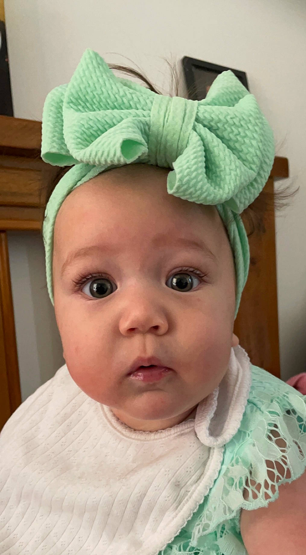 Malia is registered to the contest to win money with this photo: baby, baby_toddler_clothing, cap, cheek, child, chin, costume_hat, eyebrow, eyelash, face, fashion_accessory, forehead, green, headgear, nose, person, skin, sleeve, toddler, white