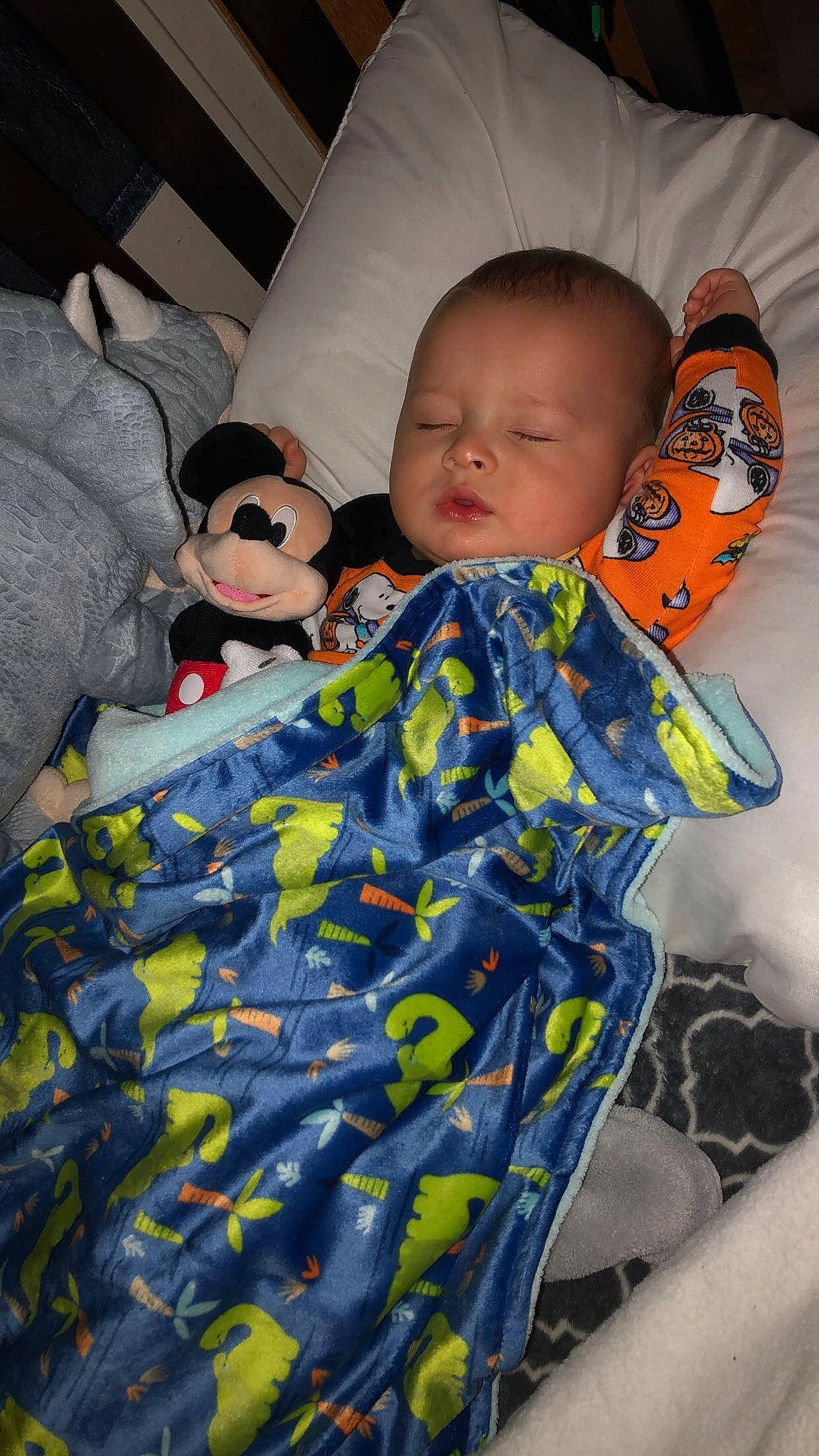 Cayden is registered to the contest to win money with this photo: baby, baby_products, baby_sleeping, baby_toddler_clothing, bedding, bedtime, child, comfort, cool, facial_expression, fun, linens, mouth, pattern, person, room, sitting, skin, sleeve, textile