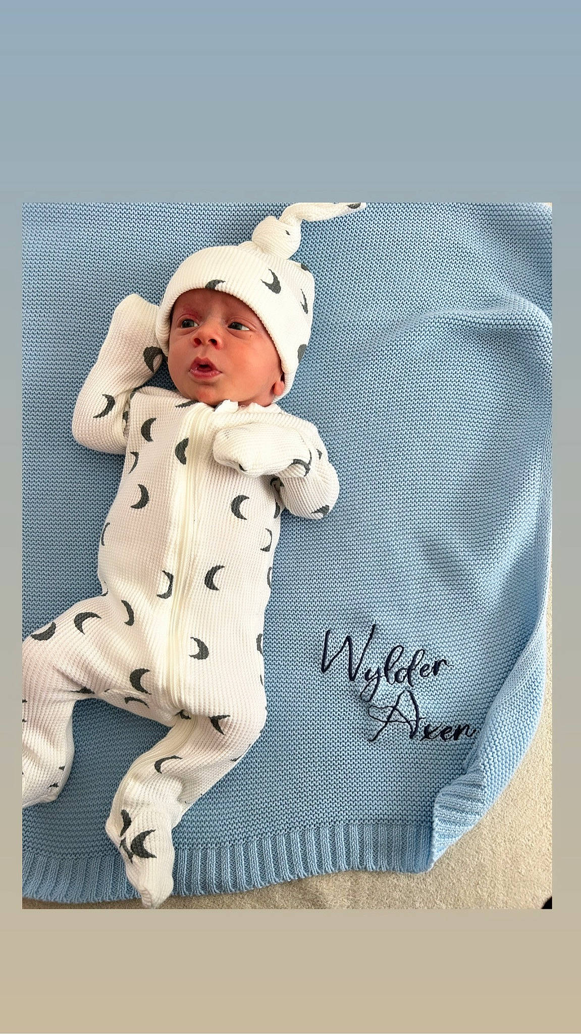 Wylder is registered to the contest to win money with this photo: baby, baby_products, baby_sleeping, baby_toddler_clothing, beanie, cap, child, comfort, costume_hat, font, fur, hat, headwear, linens, outerwear, pattern, person, rectangle, sitting, sleeve
