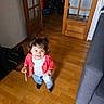 Clémence a rejoint le concours — aidez-le/la à gagner de superbes lots ! backpack, blue_jeans, child, coral_cardigan, cute, door, door_glass_panels, grey_sofa, happy, indoor, living_room, pigtails, smiling, socks, stick, stroller, tape_roll, toddler, white_shirt, wooden_floor